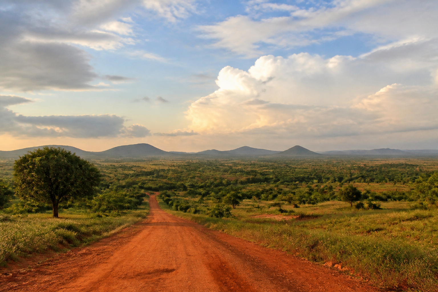 Open landscape under a wide sky, suggesting possibility and journey